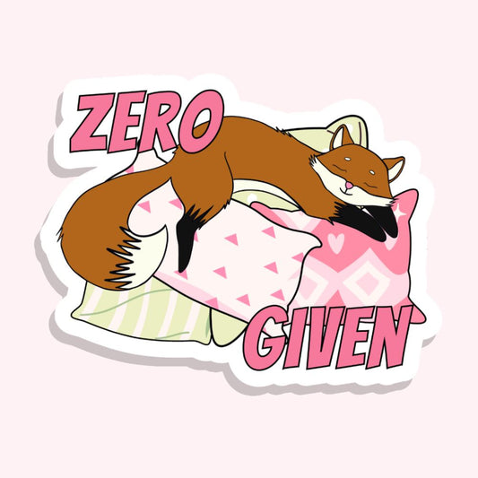 zero fucks given sticker with a fox asleep on a pile of pillows play on words sticker on white vinyl by elle and dina design