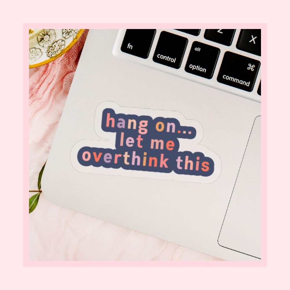 hang on let me overthink this multicolour text with dark blue background on transparent vinyl by elle and dina design shown on a laptop